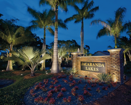 Entrance lighting for Jacaranda Lakes community at night - Landscape lighting Orlando