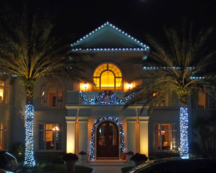 holiday lighting on house at night - Landscape lighting Orlando