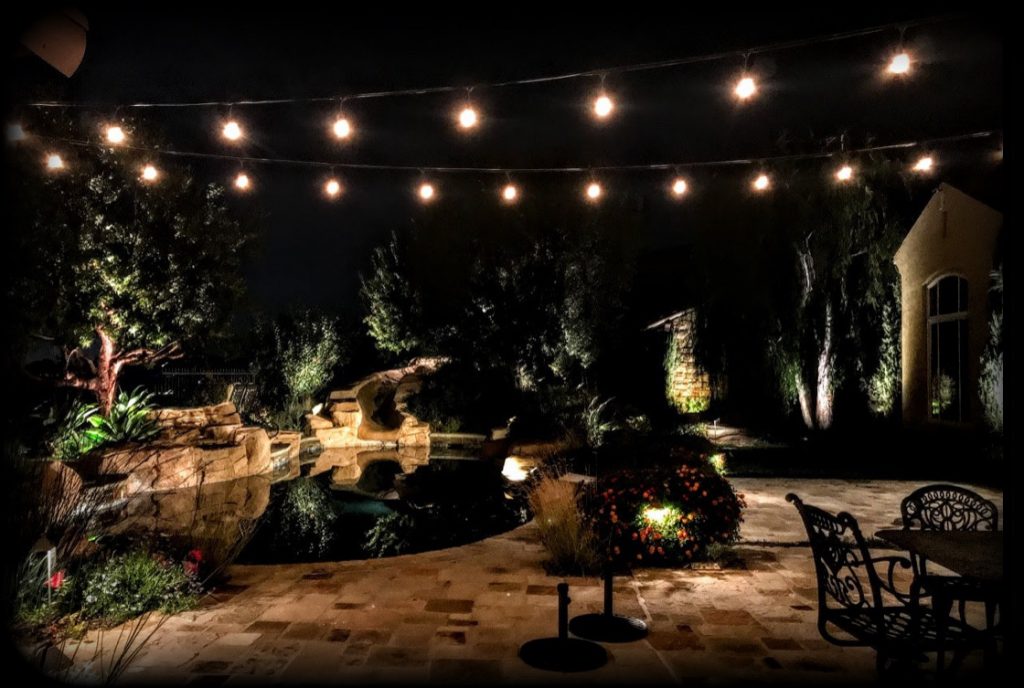 A backyard nicely lit up at night